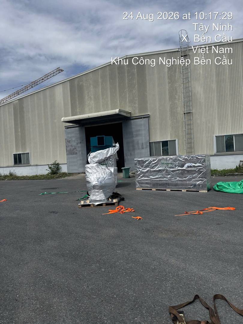 Foil-wrapped equipment unloaded in front of a warehouse in Ben Cau, Tay Ninh, near the Moc Bai border