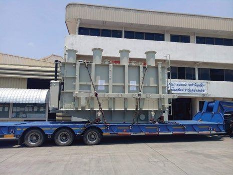 Power transformer of about 60 t on a lowbed trailer ready for road transport in Vietnam