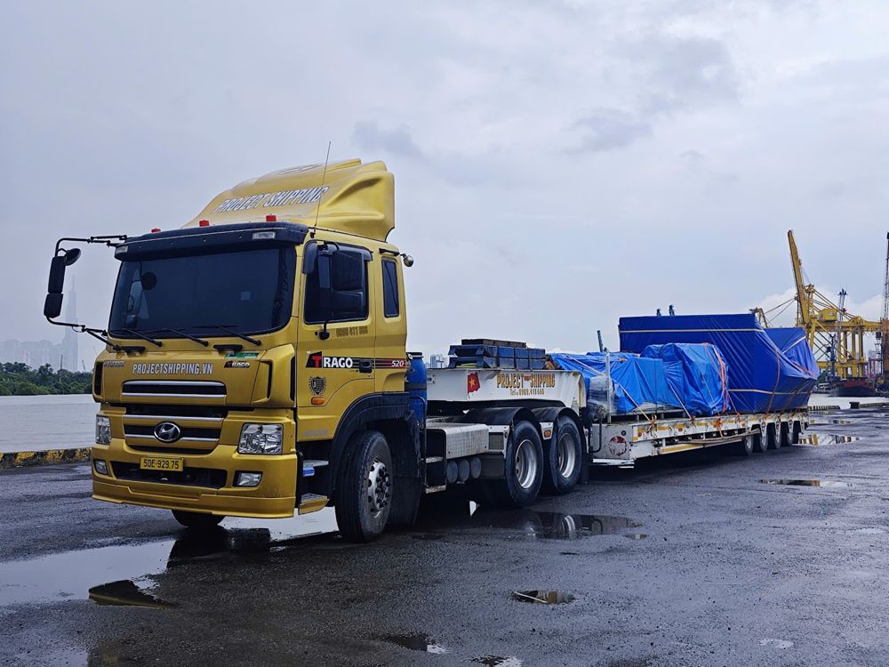 Project Shipping prime mover and lowbed at Ben Nghe river port, Ho Chi Minh City