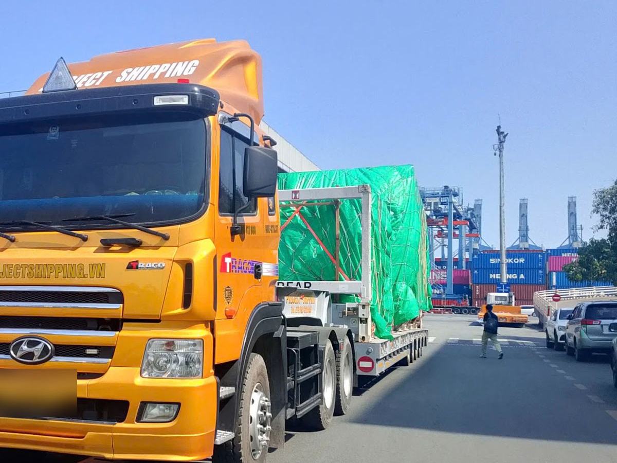 Project Shipping prime mover hauling an imported flat rack at Cat Lai terminal