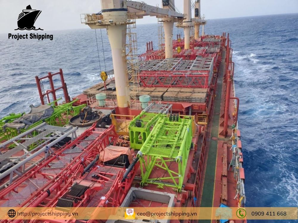 Two 900 t class crawler crane components lashed on deck of a breakbulk vessel